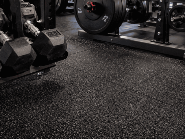 Modern commercial gym with heavy-duty rubber flooring installation