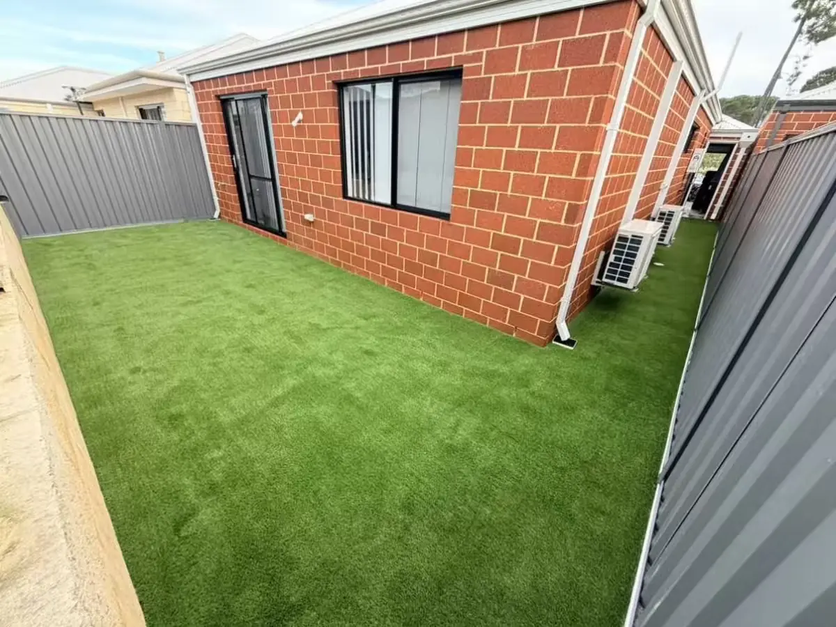 Artificial grass installed in a small Fremantle rear courtyard using Coast 35