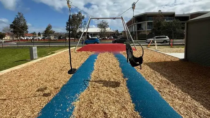 Soft fall rubber surfacing beneath the flying fox run at Kinross Primary School