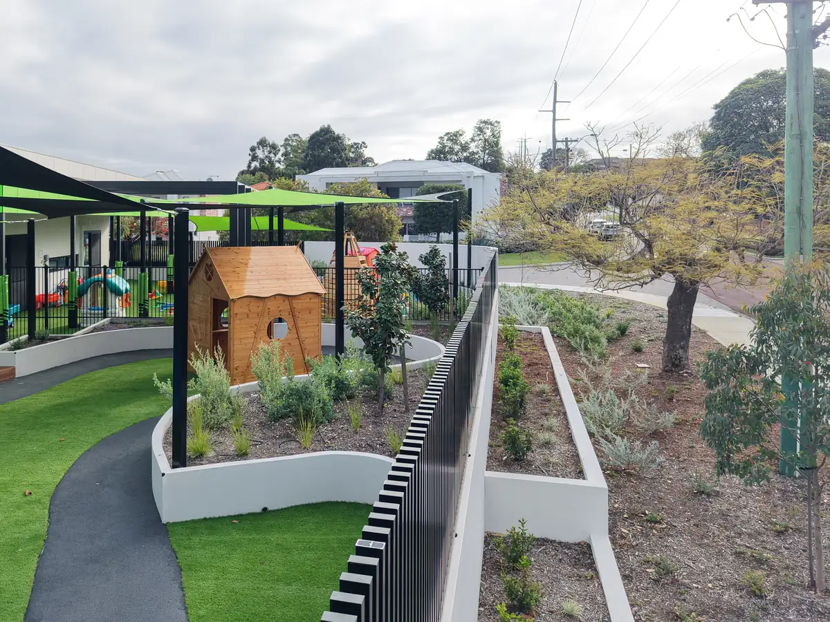 Soft fall rubber pathway running through a landscaped childcare yard in Joondanna, Perth